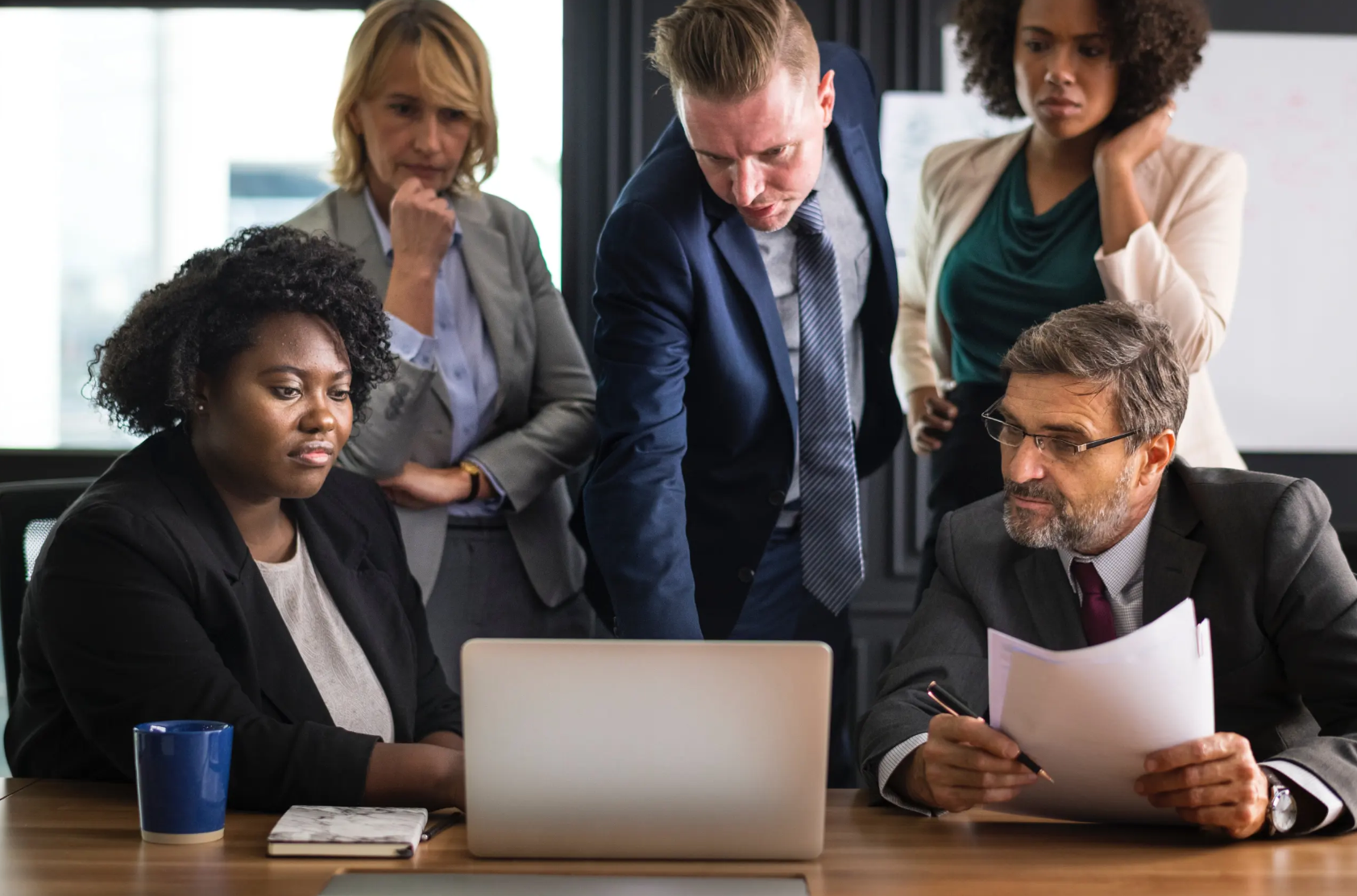 Aspiring Leader header image showing a group of people working together